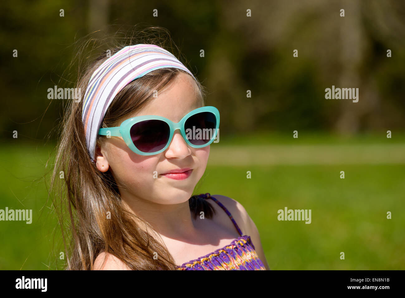 portrait of a pretty young girl with sunglasses Stock Photo - Alamy