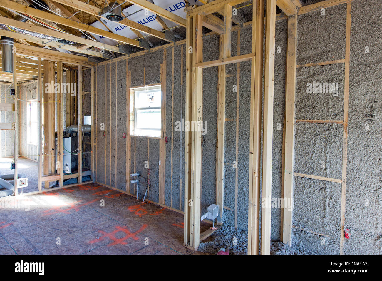 Interior frame walls with blown in insulation, construction of a Craftsman Style residential home in Colorado, USA Stock Photo