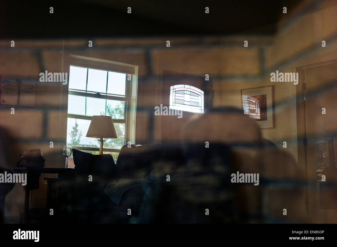 Interior view of the windows in a Craftsman Style residential home showing the leaded glass in the front door in Colorado, USA Stock Photo