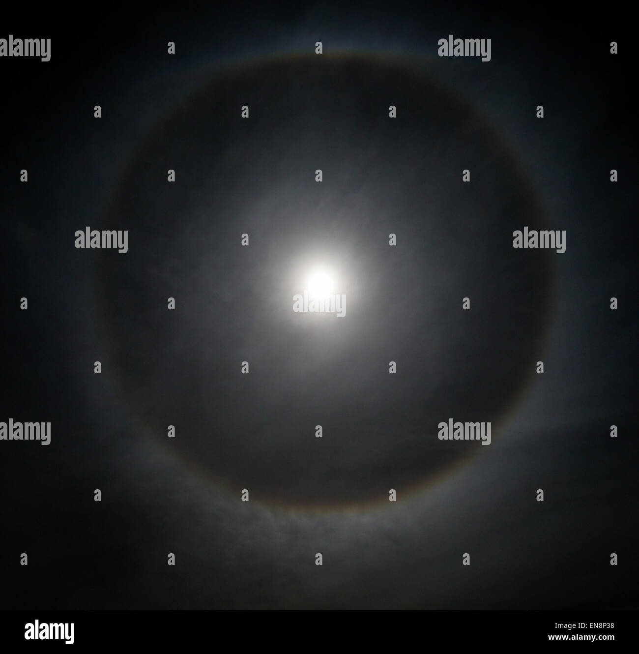 Full moon with round 'sun dog', or halo circle over Rocky Mountains, Salida, Colorado, USA Stock Photo