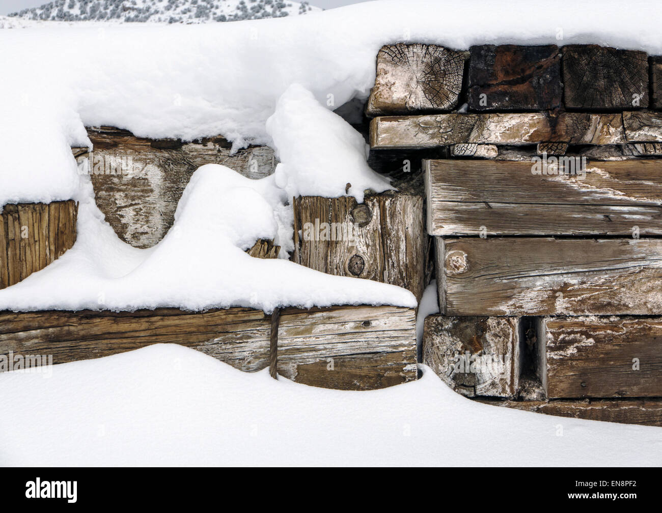 Snow creates patterns on old rail structure. Stock Photo