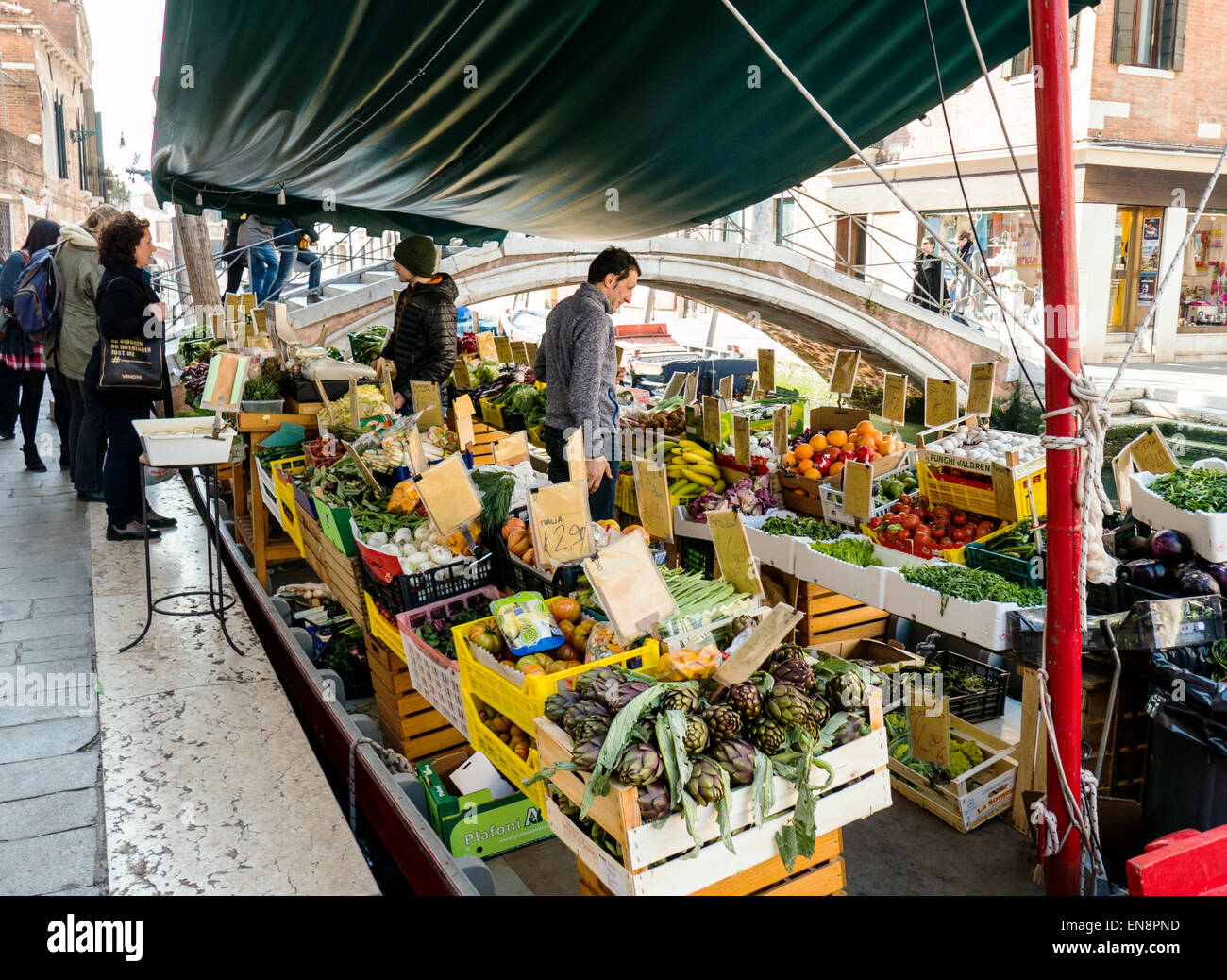 Vendor displays fresh fruit & vegetables on market boat, Venice, Italy, City of Canals Stock Photo