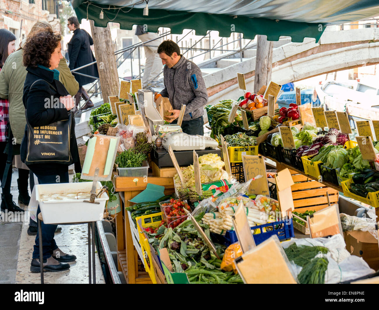 Vendor displays fresh fruit & vegetables on market boat, Venice, Italy, City of Canals Stock Photo
