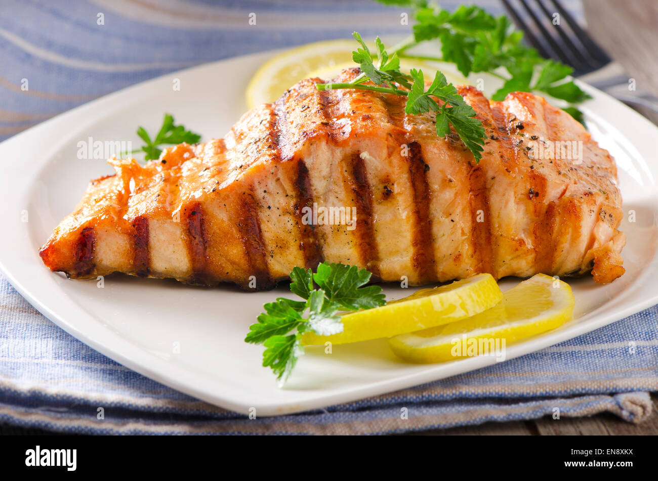 Grilled Salmon with lemon and  herb. Selective focus Stock Photo