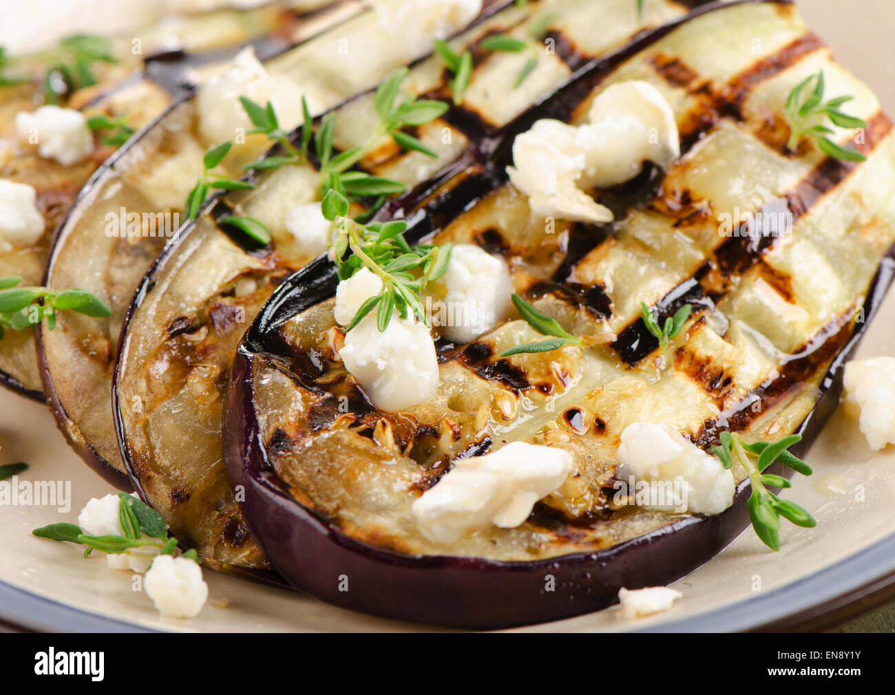 Grilled eggplant slices on a plate. Selective focus Stock Photo