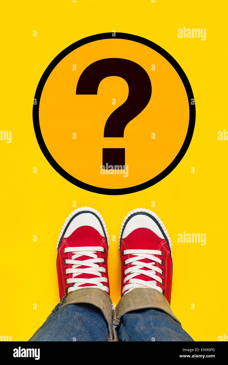 So Many Questions on Young Person Path to Growing Up with Red Sneakers from Above, Top View Stock Photo