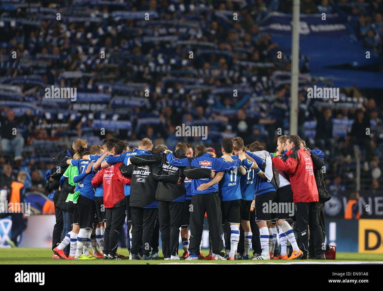 Wolfsburg, Germany. 29th Apr, 2015. Bielefeld's players stand together at the end of the DFB Cup match between Arminia Bielefeld and VfL Wolfsburg in the Schueco Arena in Wolfsburg, Germany, 29 April 2015. Credit:  dpa picture alliance/Alamy Live News Stock Photo