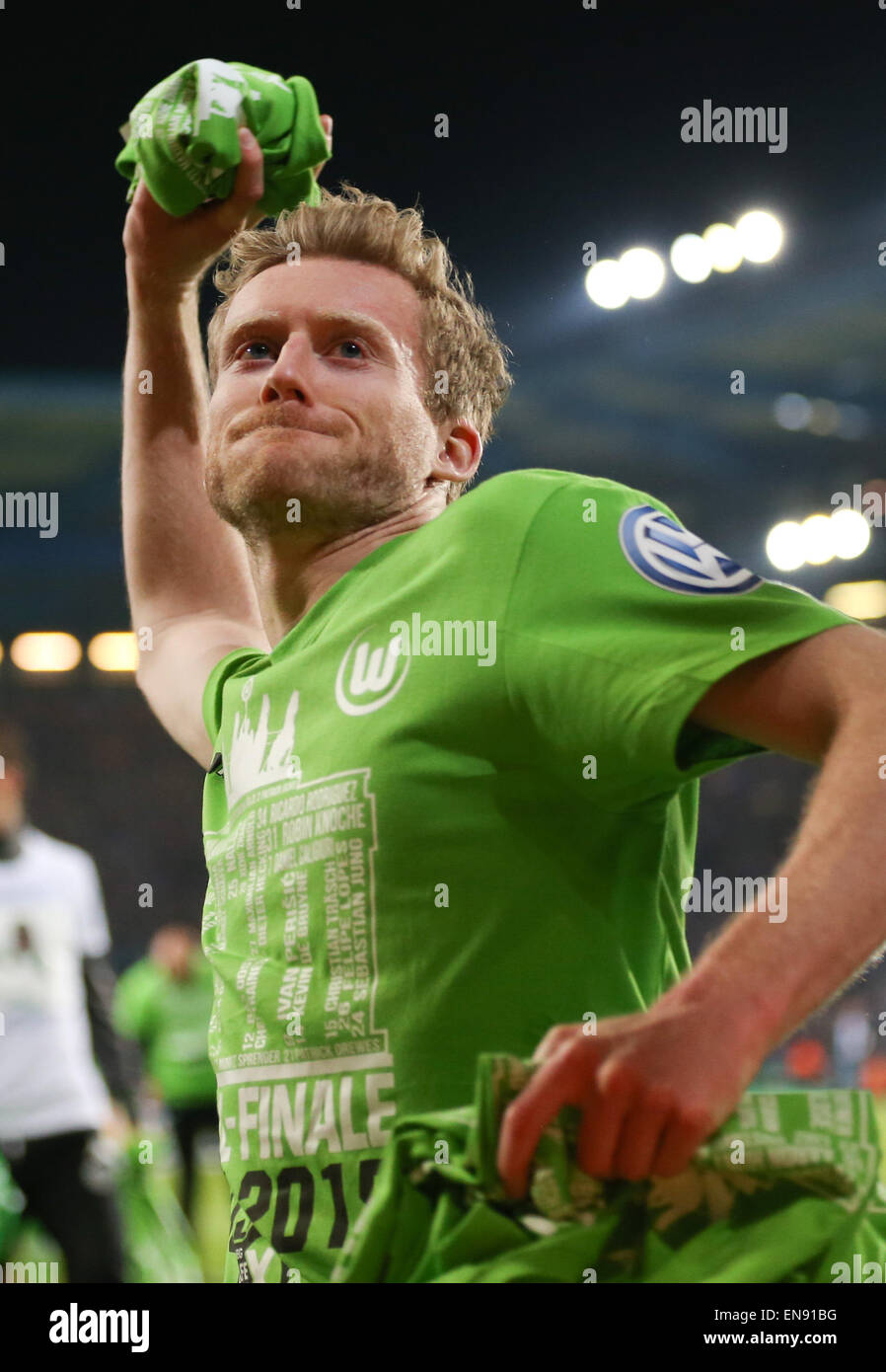Bielefeld, Germany. 29th Apr, 2015. Wolfsburg's Andre Schuerrle throws a t-shirt at the DFB Cup match between Arminia Bielefeld and VfL Wolfsburg in the Schueco Arena in Bielefeld, Germany, 29 April 2015. Credit:  dpa picture alliance/Alamy Live News Stock Photo