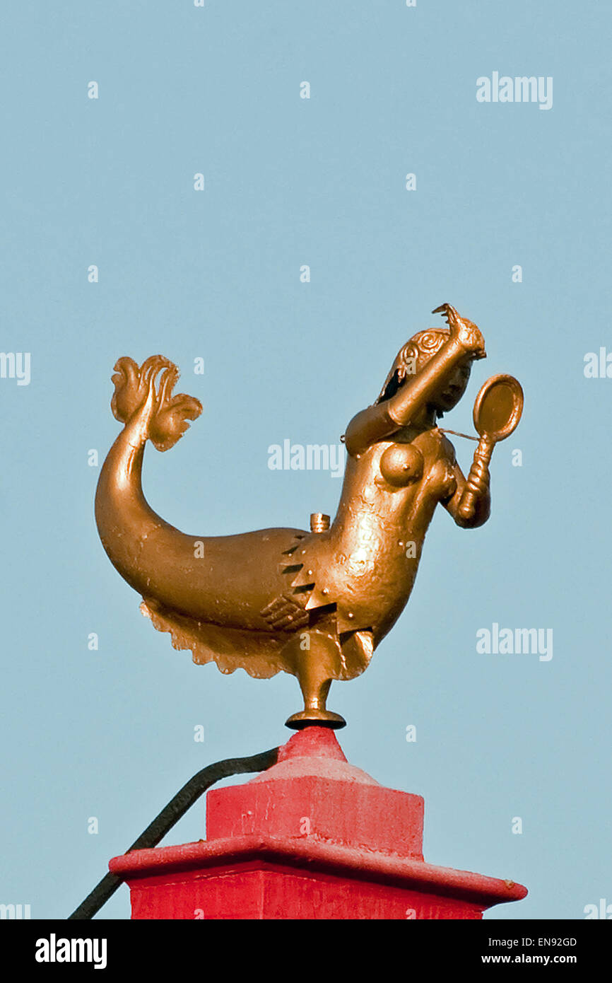 Golden mermaid weathervane on a rooftop in the Market Place, Bruges
