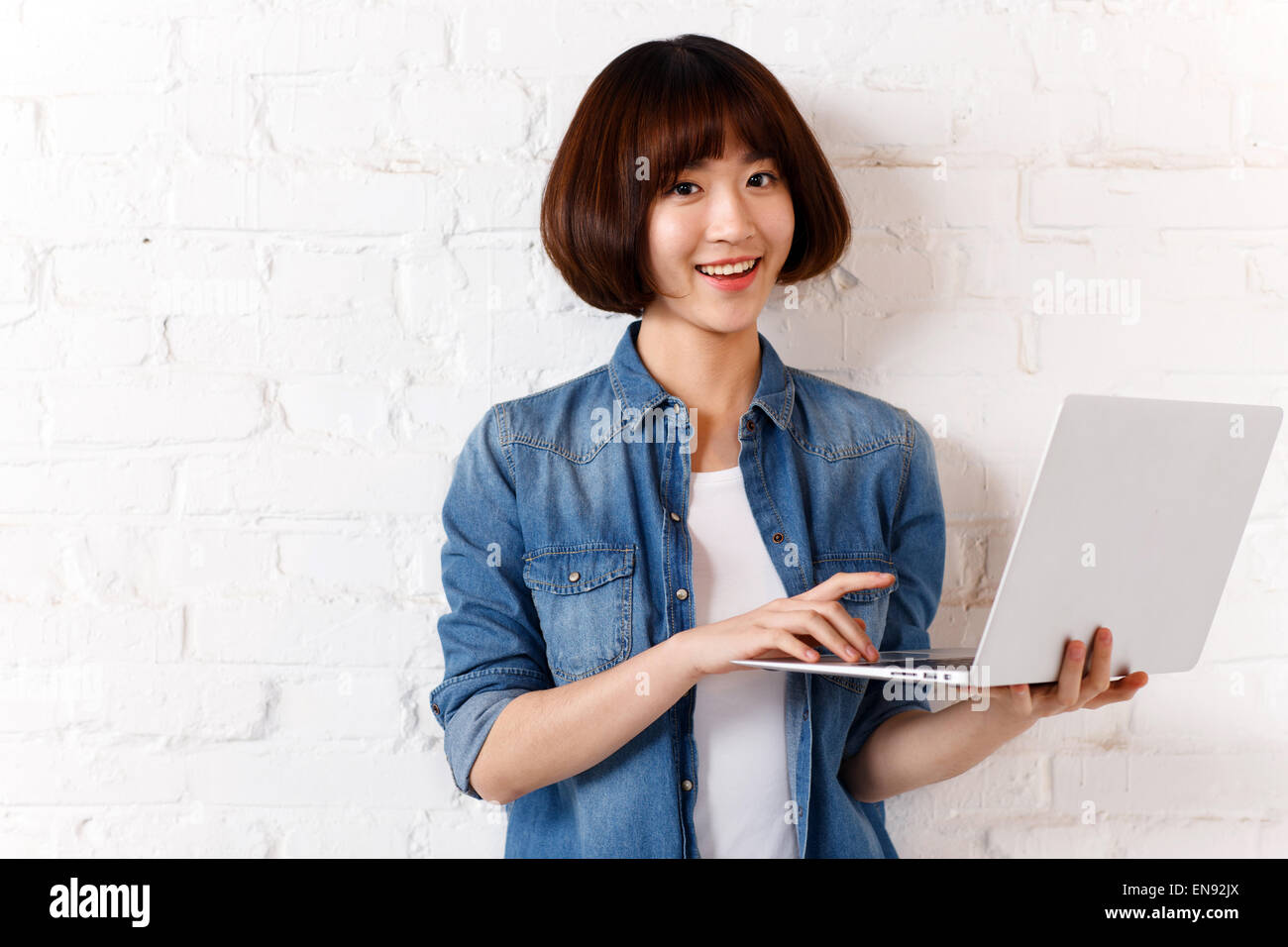 The young woman with palmtop computer Stock Photo