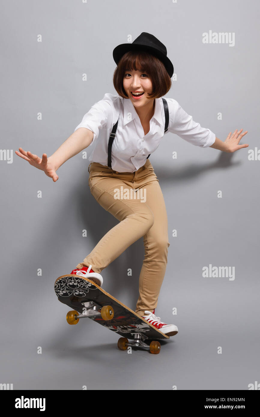 The young woman skateboarding Stock Photo Alamy
