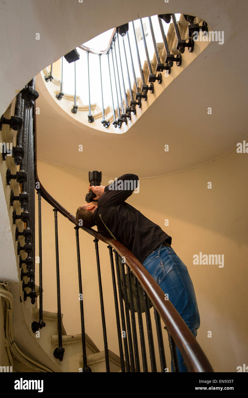 Photographer shooting staircase in Passage Vero-Dodat, Paris, France Stock Photo