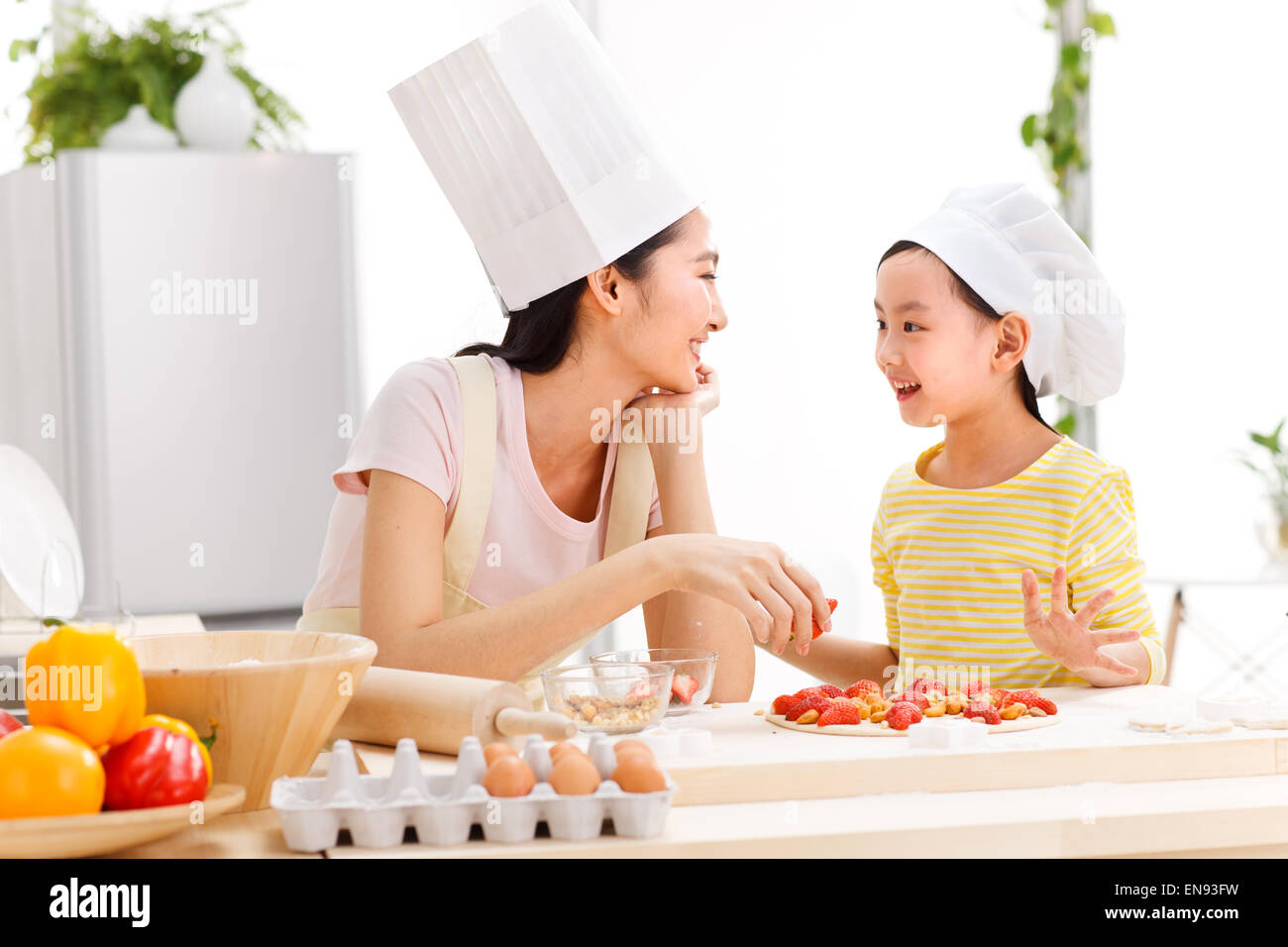 Indian Mother Cooking With Her Daughters At Kitchen Stock Photo, Picture  and Royalty Free Image. Image 47178741.