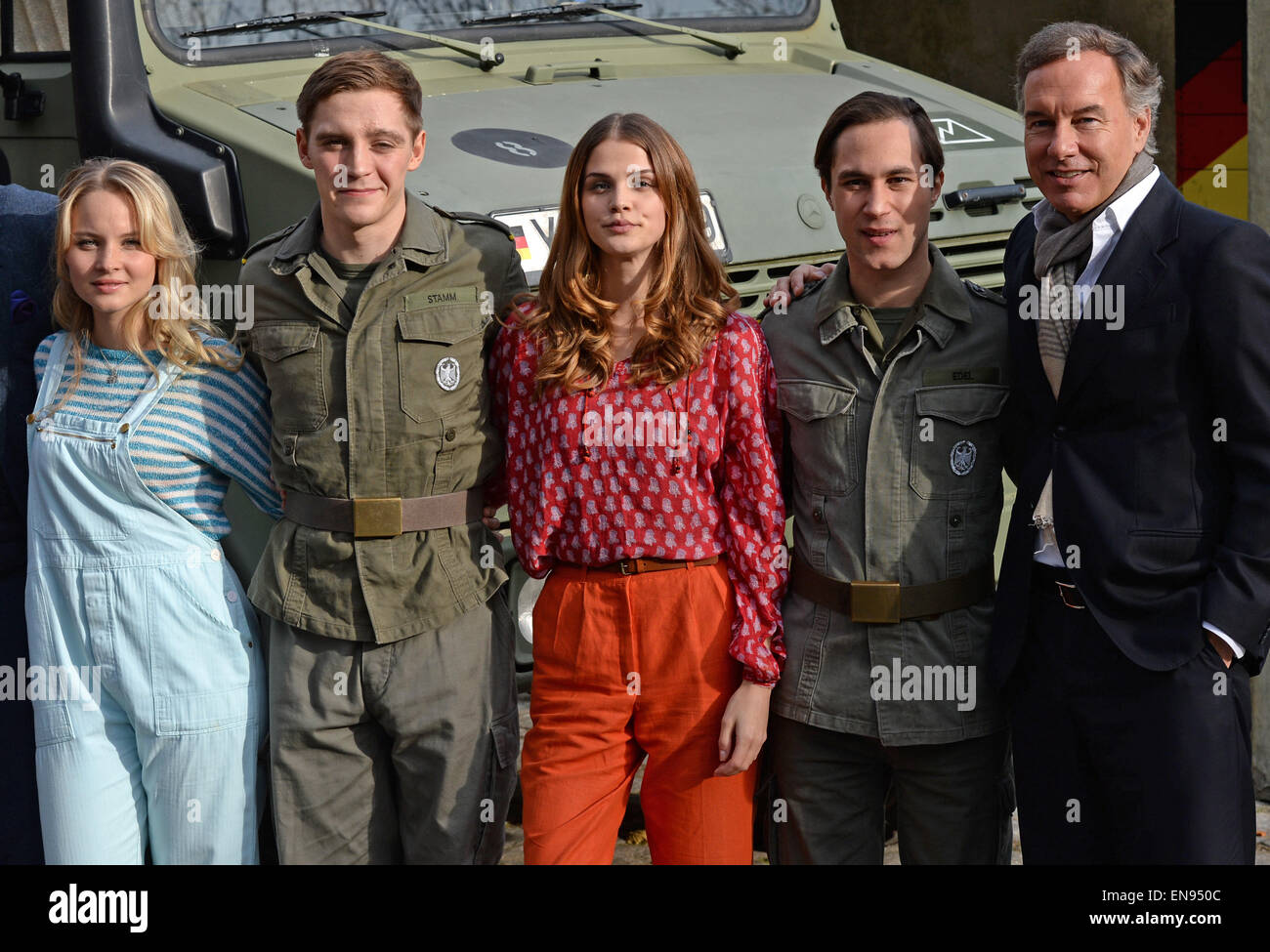 Actors (l-r) Sonja Gerhardt, Jonas Nay, Lisa Tomaschewsky, Ludwig Trepte and producer Nico Hofmann smile during a photo session on the set of 'Germany!', an eight-episode RTL series in Potsdam (Brandenburg), Germany, 03 November 2014. The filming of the series started on 25 August in and around Berlin and tells a German-German history from 1983. Photo: Ralf Hirschberger/dpa Stock Photo