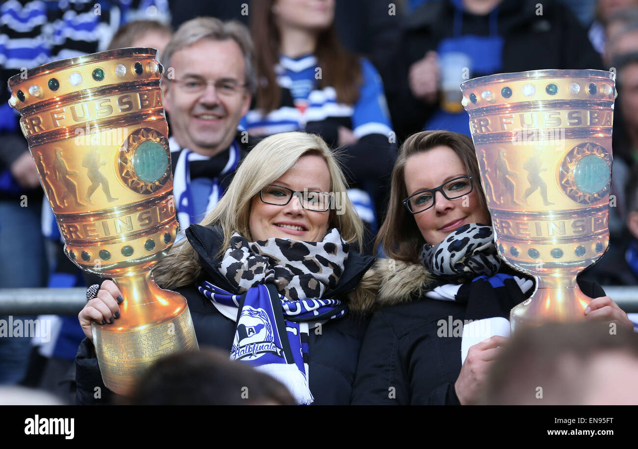 Bielefeld, Germany. 29th Apr, 2015. Bielefeld fans hold up copies of the DFB trophy at the DFB Cup match between Arminia Bielefeld and VfL Wolfsburg in the Schueco Arena in Bielefeld, Germany, 29 April 2015. Credit:  dpa picture alliance/Alamy Live News Stock Photo
