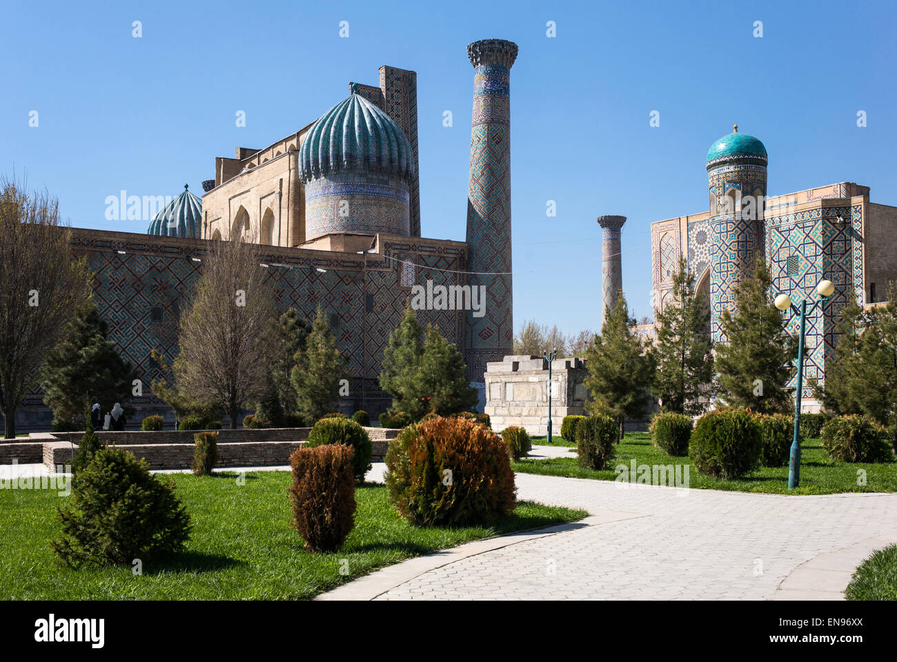 Uzbekistan, Samarkand, the garden leading to the Registan square with the wanderful mosque and madrassah Stock Photo