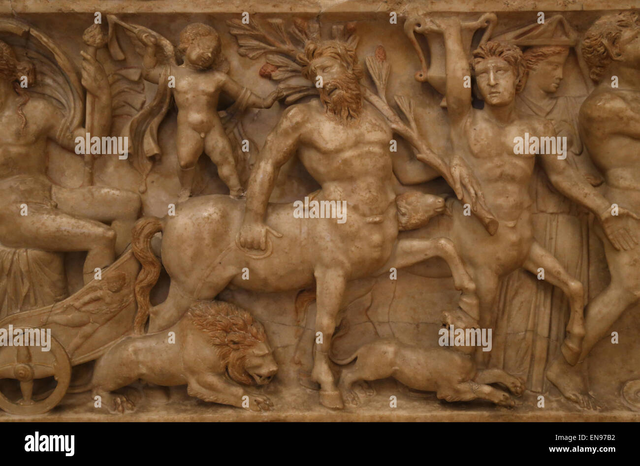 Roman art. Sarcophagus with Dionysian procession. Dionysus on the chariot,  Cupido, lion, centaurs and panther. Detail. Stock Photo