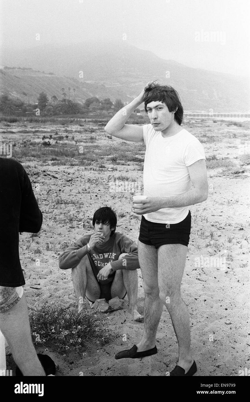 The Rolling Stones. Keith Richards and Charlie Watts seen here posing on Malibu beach. According to the photographers ' The boys had some hamburgers and played football and were happy to be beside the sea' However it was too cold to go swimming. During th Stock Photo