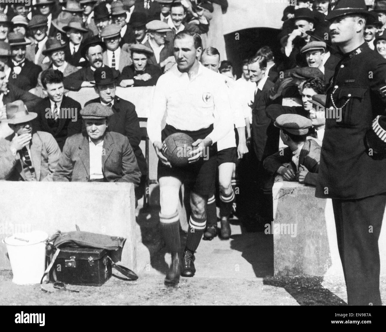 Tottenham Hotspur captain Arthur Grimsdell leads out his team for a match, circa 1920. Stock Photo