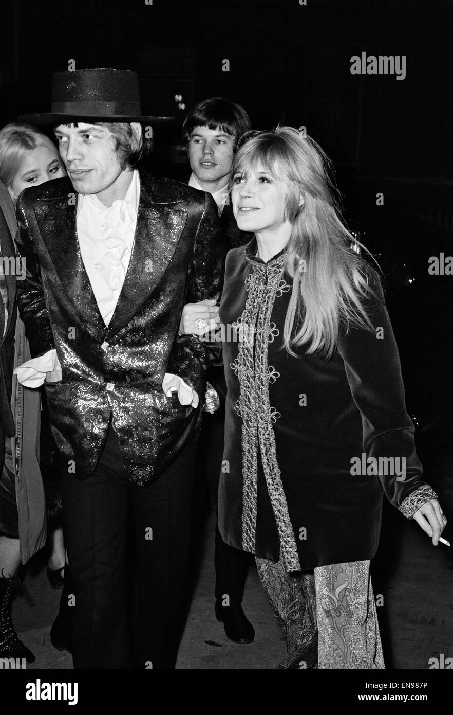 Mick Jagger of The Rolling Stones and Marianne Faithful arriving at The Royal Opera House to see a ballet premiere starring Margot Fonteyn and Rudolph Nureyev. 23rd February 1967. Stock Photo