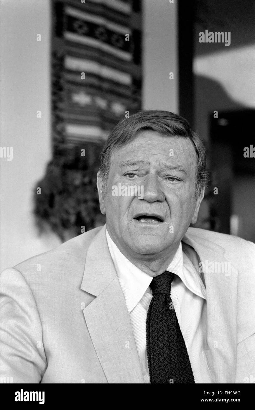 John Wayne who recently starred in 'Brannigan' photographed at home in Texas. 8th June 1975 Stock Photo