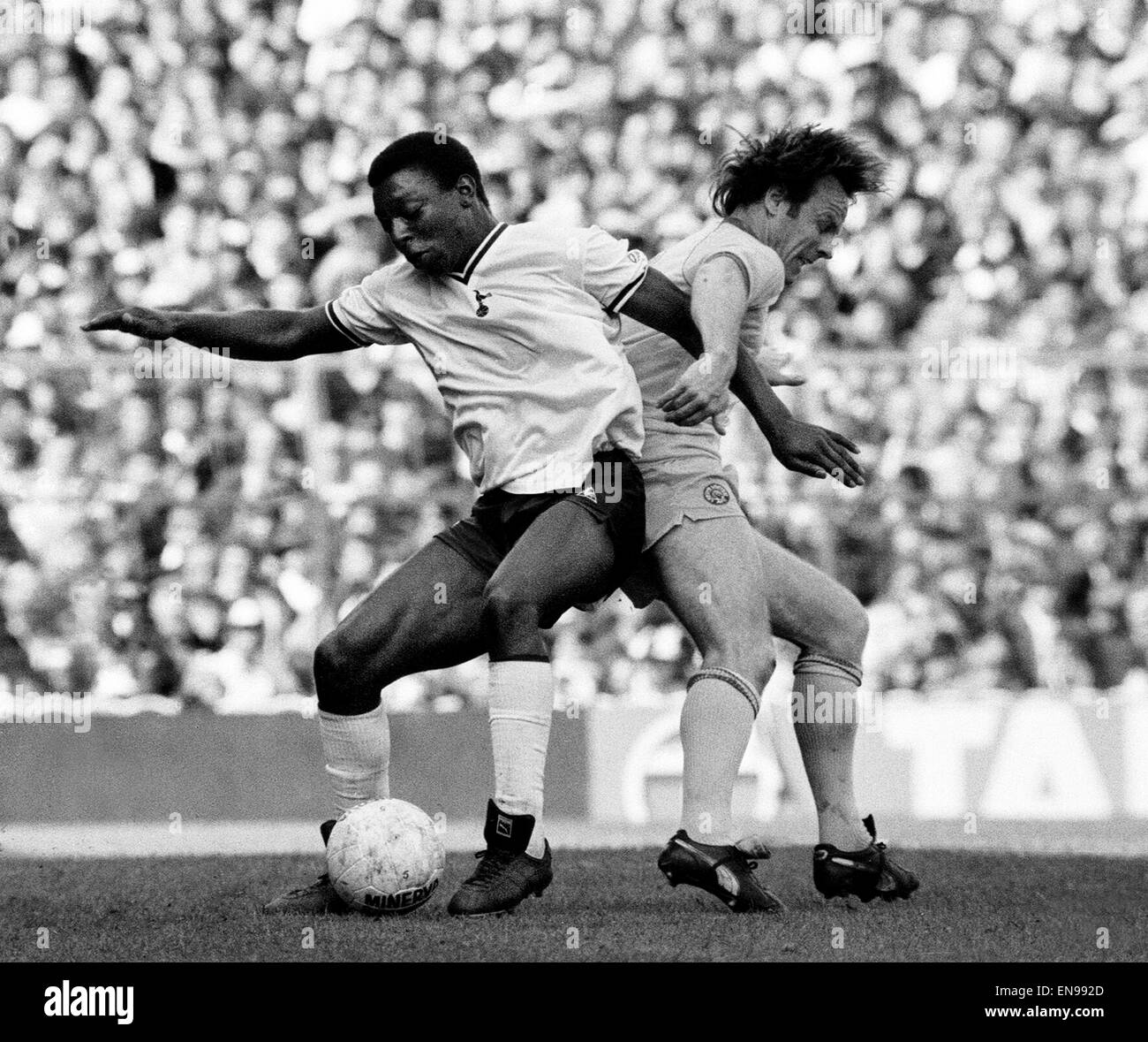 English League Division One match at White Hart Lane. Tottenham Hotspur 2 v Leeds United 1. Garth Crooks of Spurs on the ball tangling with Arthur Graham. 8th May 1982. Stock Photo