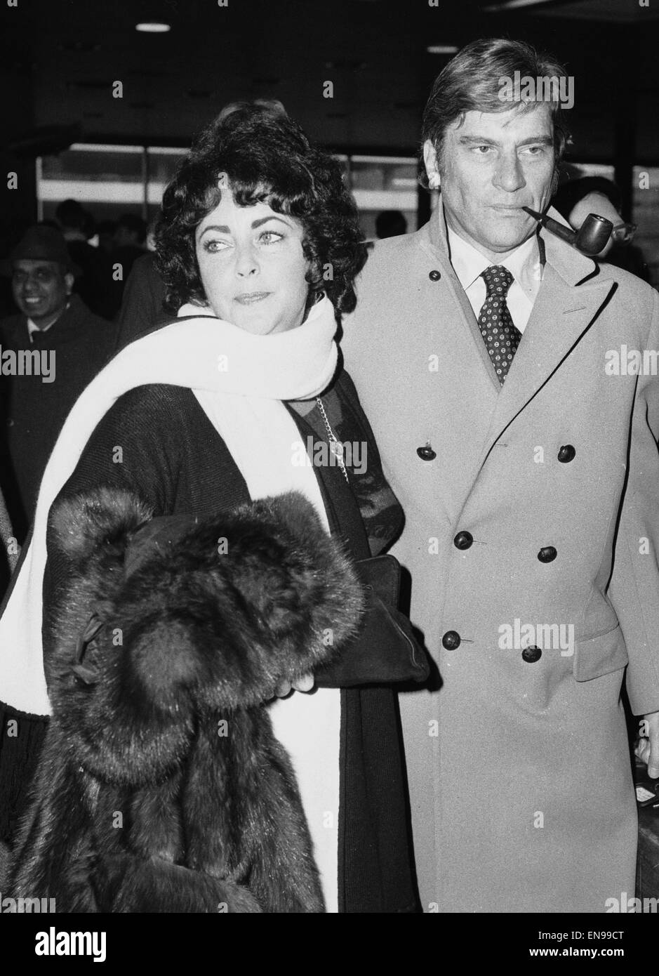 Elizabeth Taylor and husband John Warner seen here at Heathrow Airport before departing for Washington on Concorde, 16th December 1976 Stock Photo