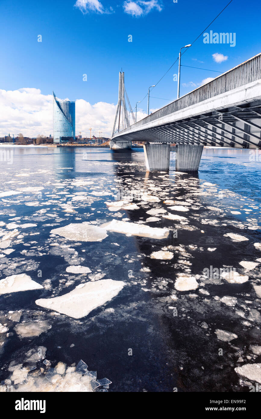 Ice drift in the cable-stayed bridge in Riga on the Daugava spring on a sunny day Stock Photo
