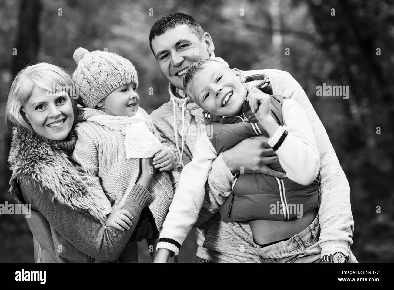 Family in the autumn park Stock Photo