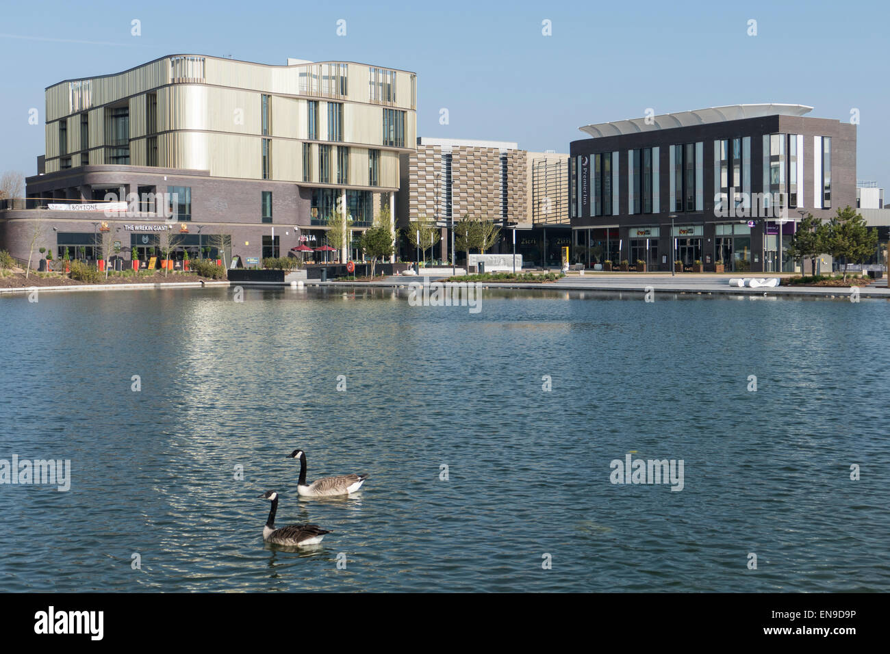 England, Shropshire, Telford, Town park pond & shops Stock Photo Alamy