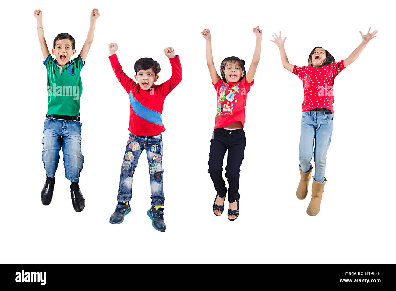 4 indian indian Kids Friends Jumping Stock Photo