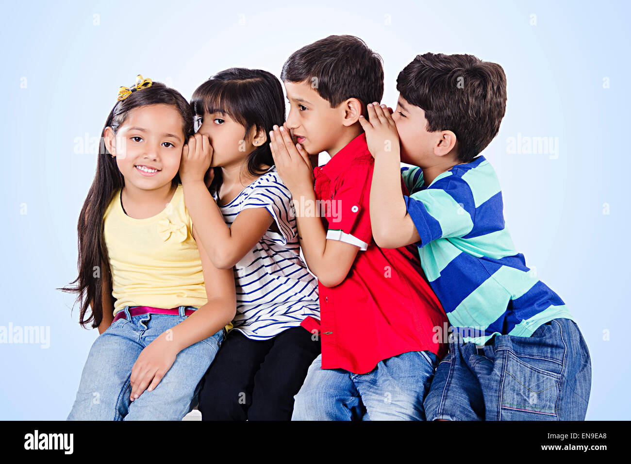 4 indian indian Kids Friends Whisper Stock Photo