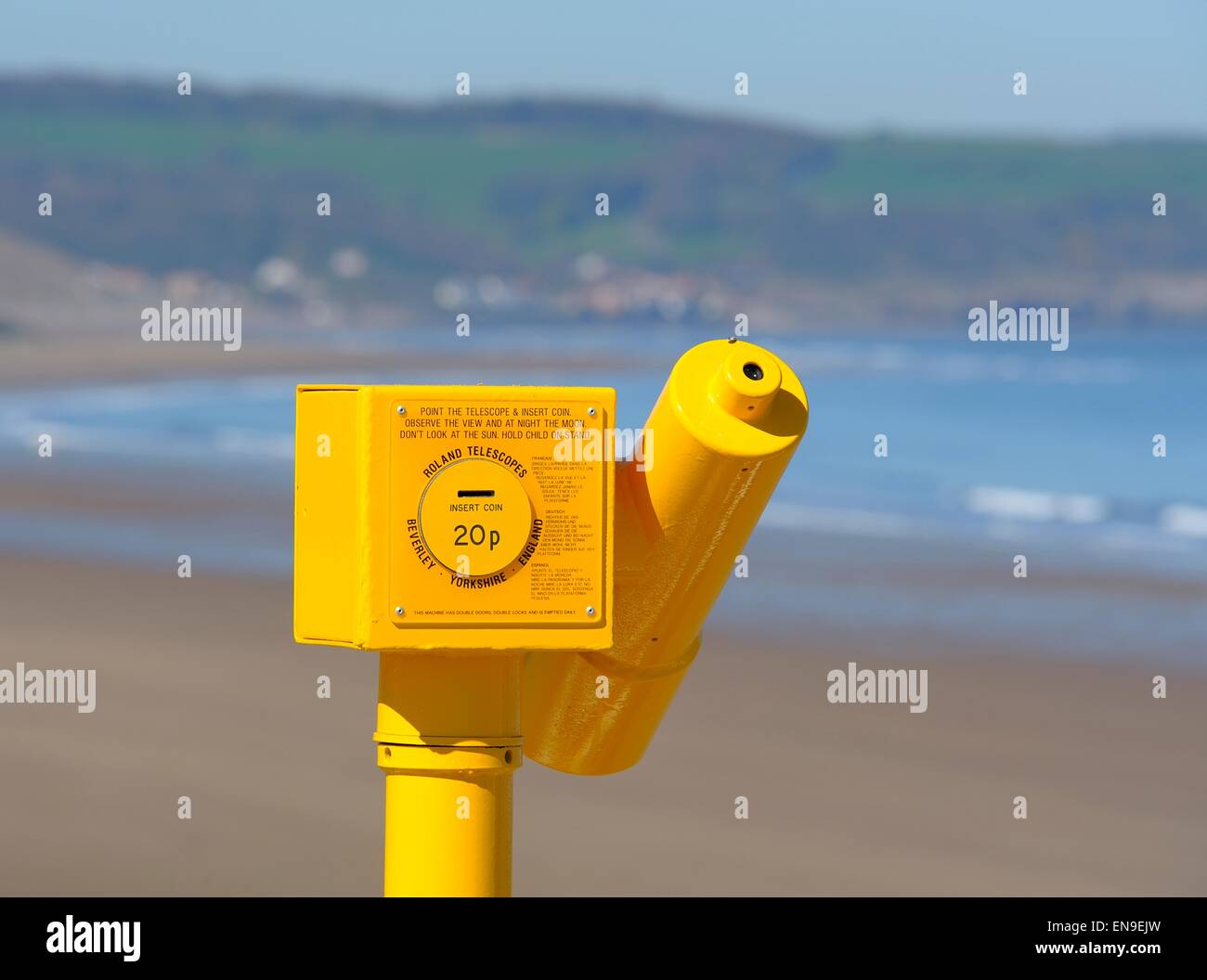 A yellow telescope on the sea front in Whitby North Yorkshire England UK Stock Photo