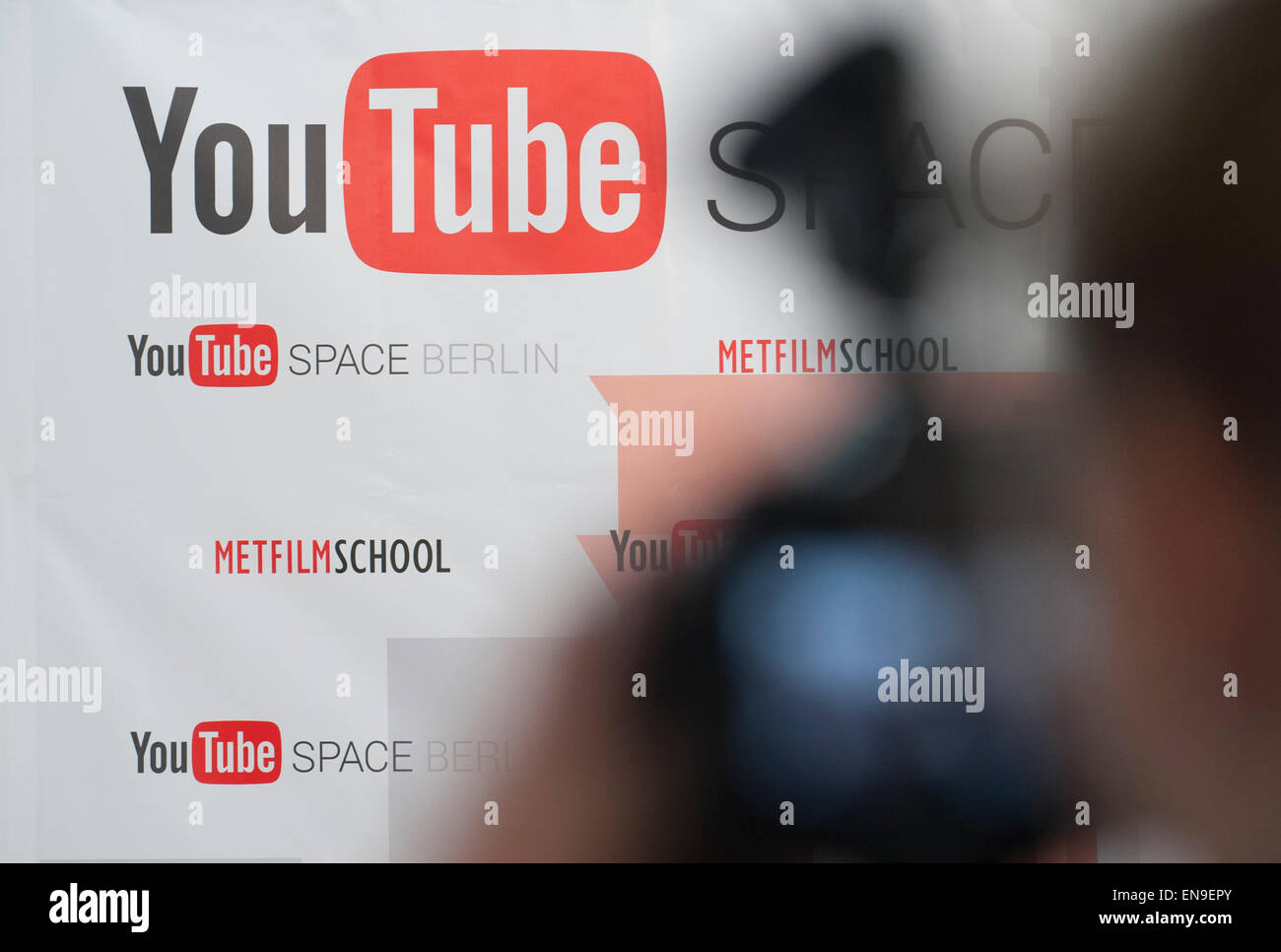 Berlin, Germany. 30th Apr, 2015. The logo of video-sharing website 'Youtube' is pictured on a board in Berlin, Germany, 30 April 2015. Youtube introduced a new gathering place and studio for producers of Youtube videos to journalists. The place may be used by Youtube members with more than 1000 subscribers. It is the first of its kind in Europe. PHOTO: PAUL ZINKEN/dpa/Alamy Live News Stock Photo