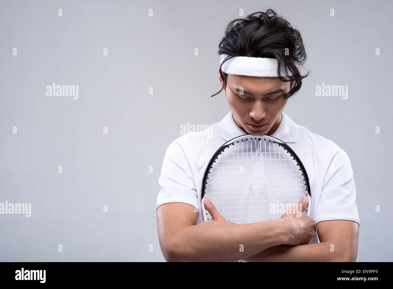 Professional sportsperson playing competition sport holding tennis
