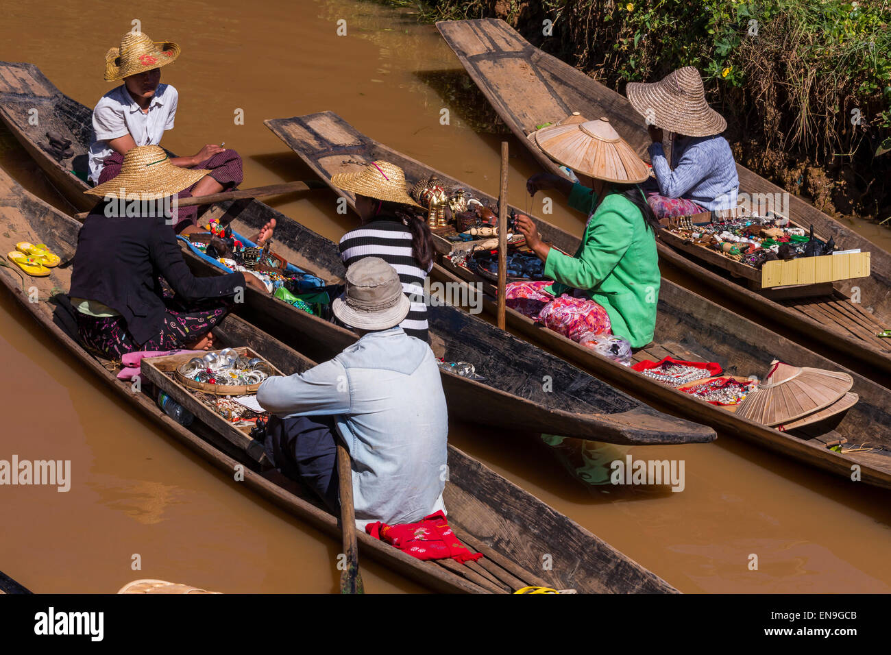 Boat venders selling products in the floating market of Inle Lake Stock Photo