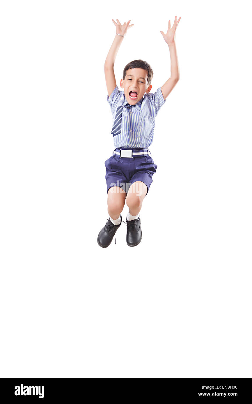 1 indian kids boy School Student Jumping Stock Photo