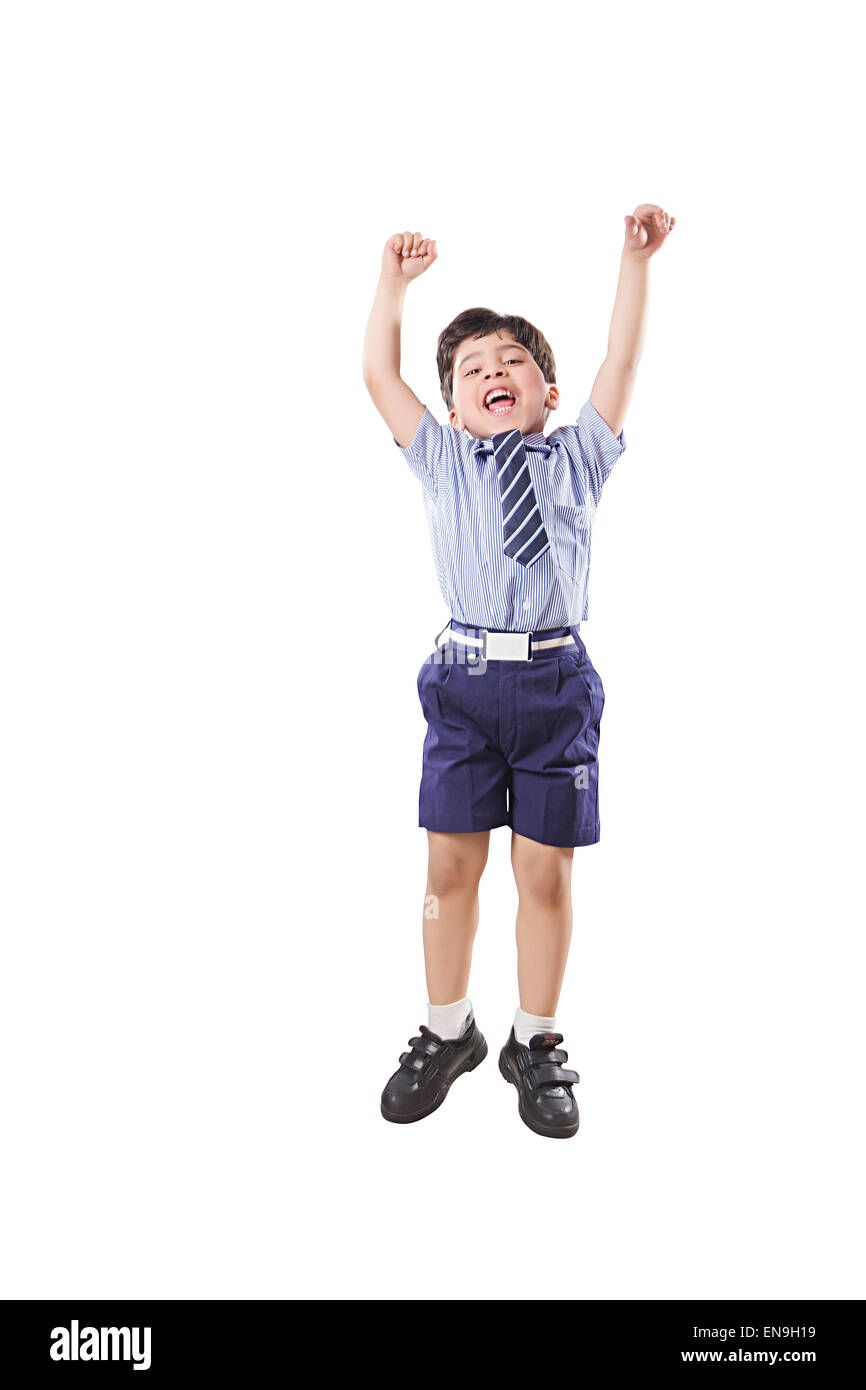 1 indian kids boy School Student Jumping Stock Photo