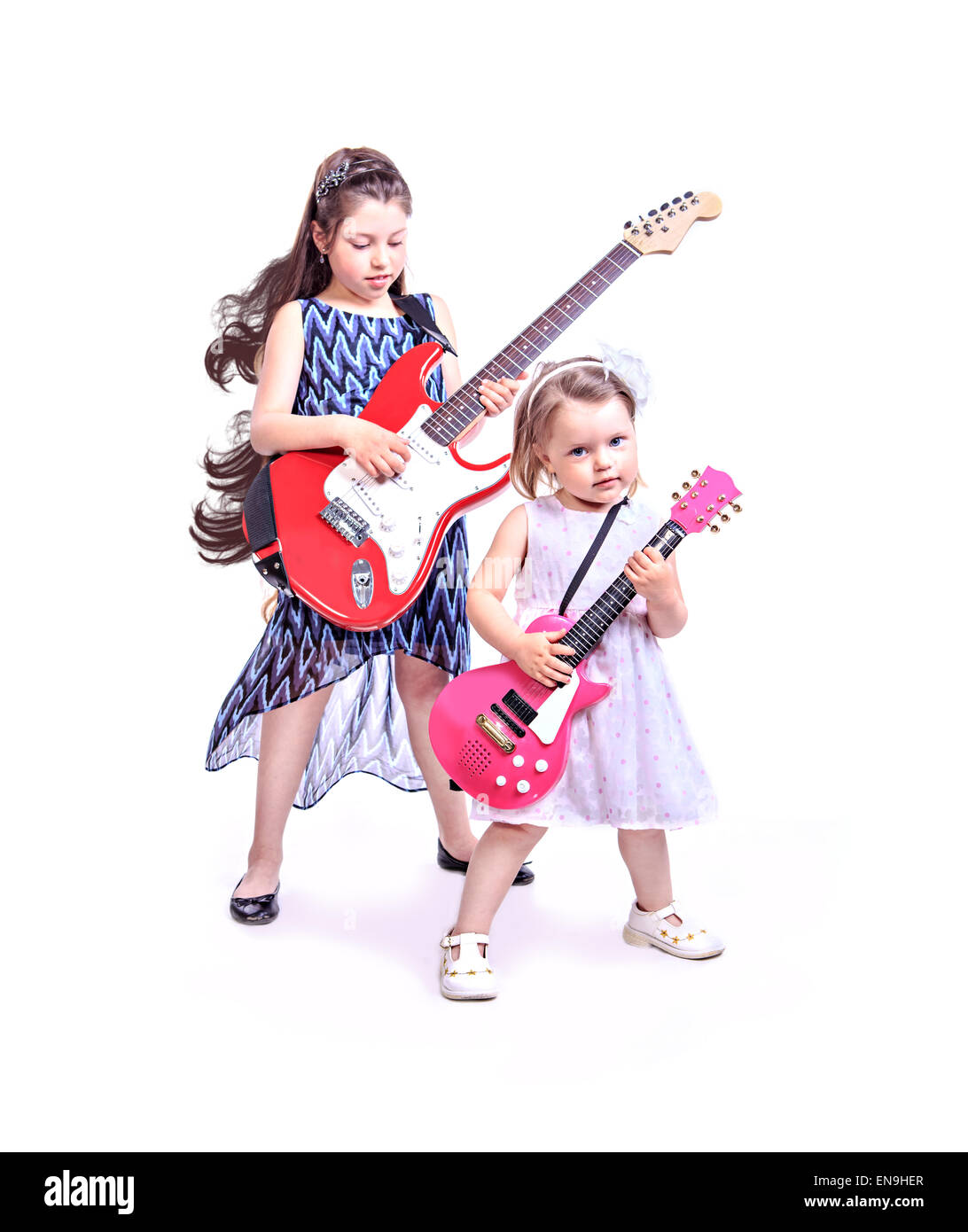 two little girls with the guitars on the stage Stock Photo