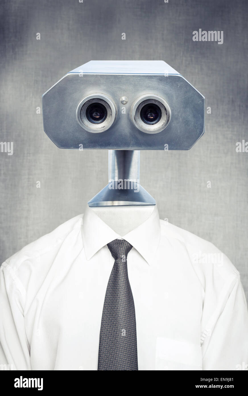 Closeup frontal portrait of vintage robot android in white shirt with classical tie over gray background Stock Photo