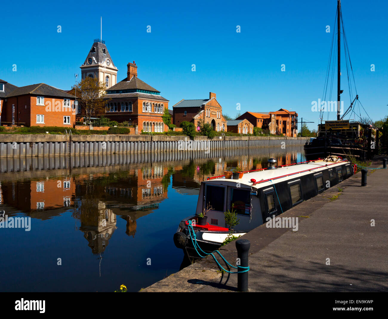 Buildings reflected in the River Trent at Newark on Trent a town in Nottinghamshire in the East Midlands England UK Stock Photo