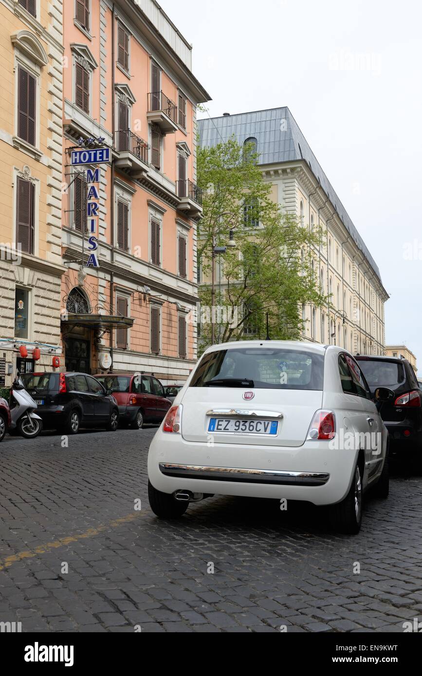 Fiat 500 car parked on a cobble street in Rome, Italy Stock Photo - Alamy