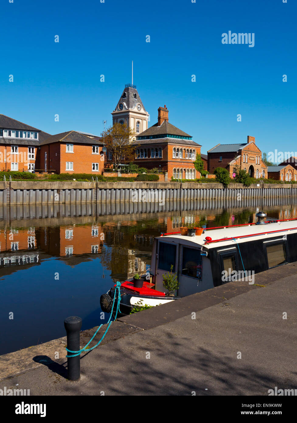 Buildings reflected in the River Trent at Newark on Trent a town in Nottinghamshire in the East Midlands England UK Stock Photo