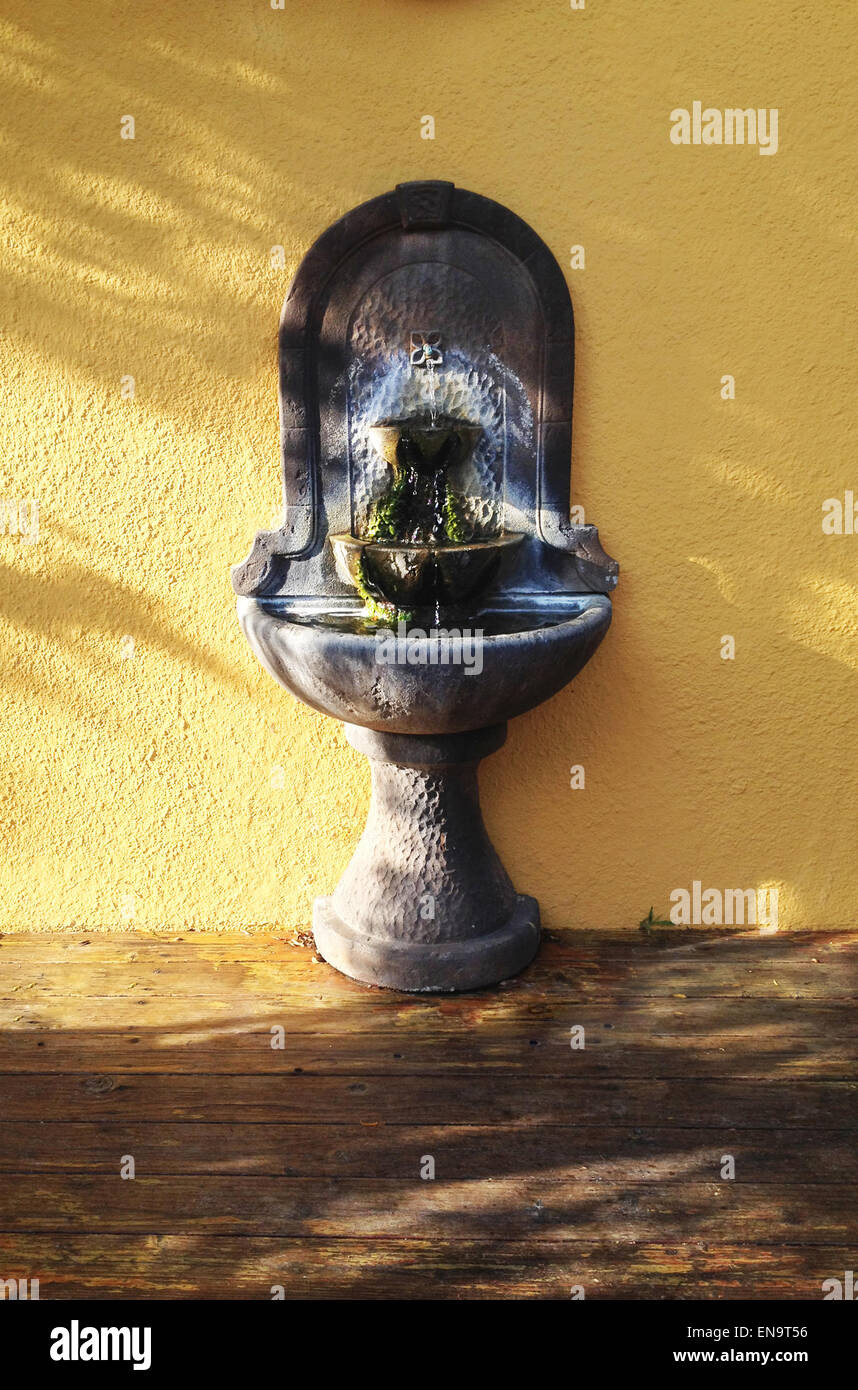 Southwest style wall fountain in the sunset, 2015. Stock Photo