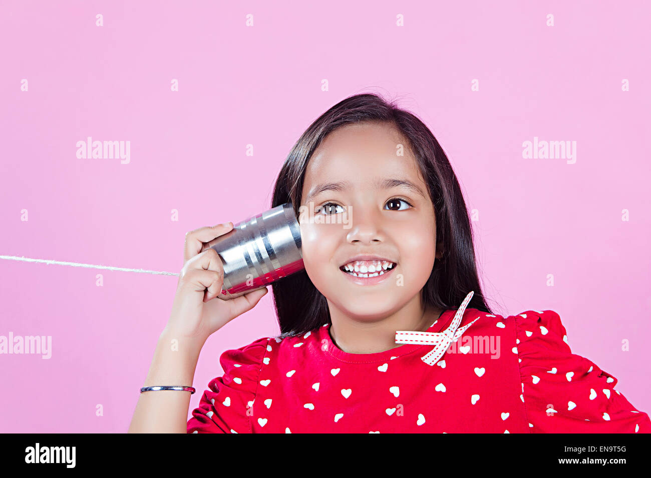 1 indian kids girl Toy Phone hearing Stock Photo