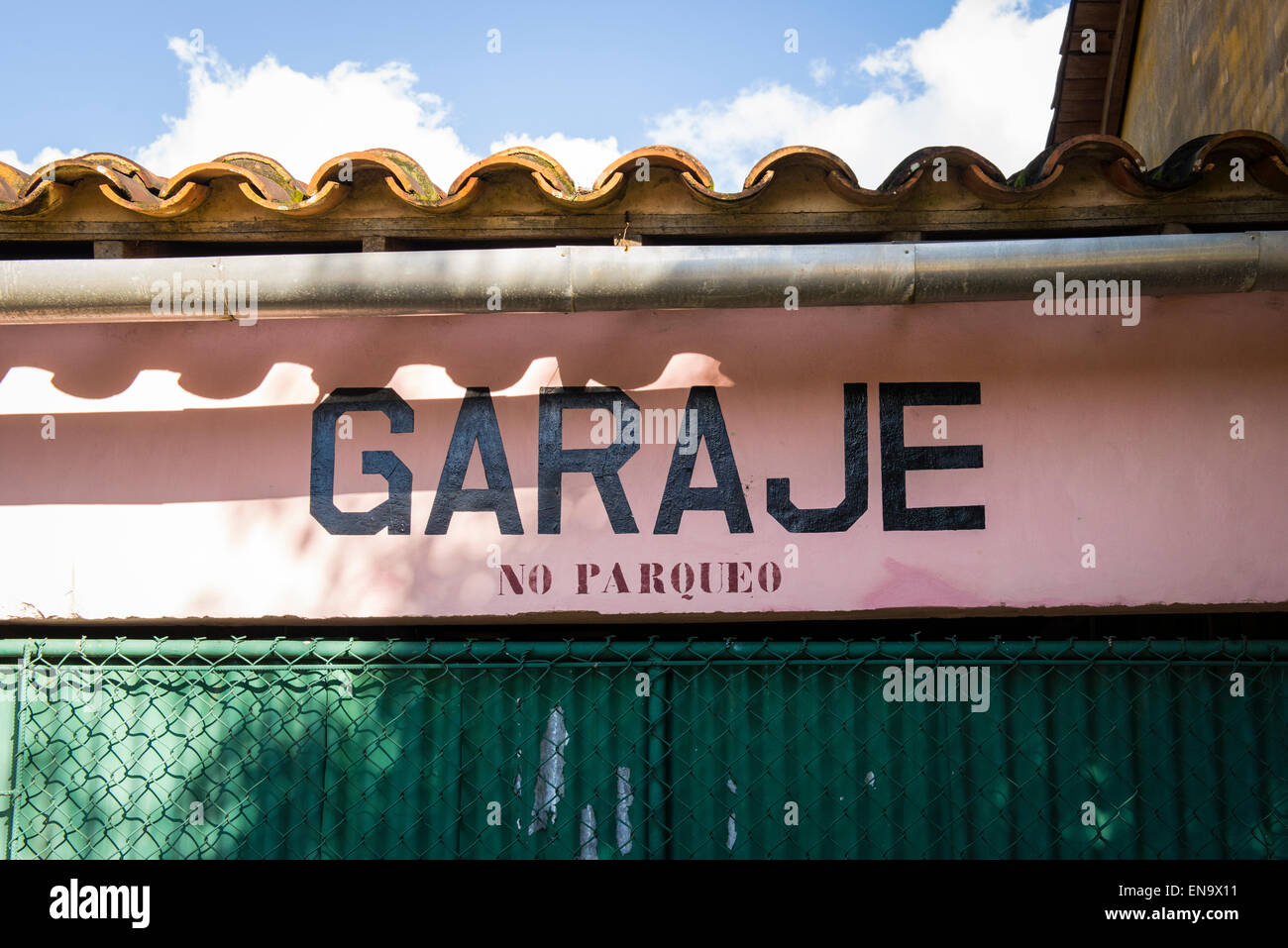 Cuba Vinales Calle Salvador Cisneros main street typical scene road garaje garage - No Parqueo no parking sign Stock Photo