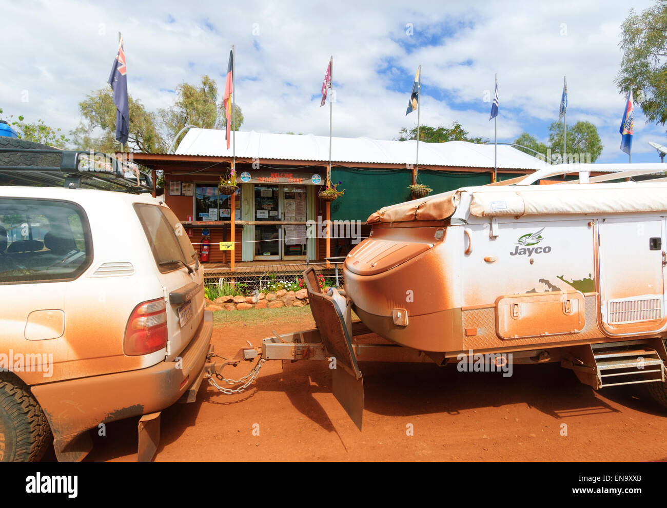 Outback Motoring, car towing a trailer covered in red dust, Kimberley Region, Western Australia, WA, Australia Stock Photo