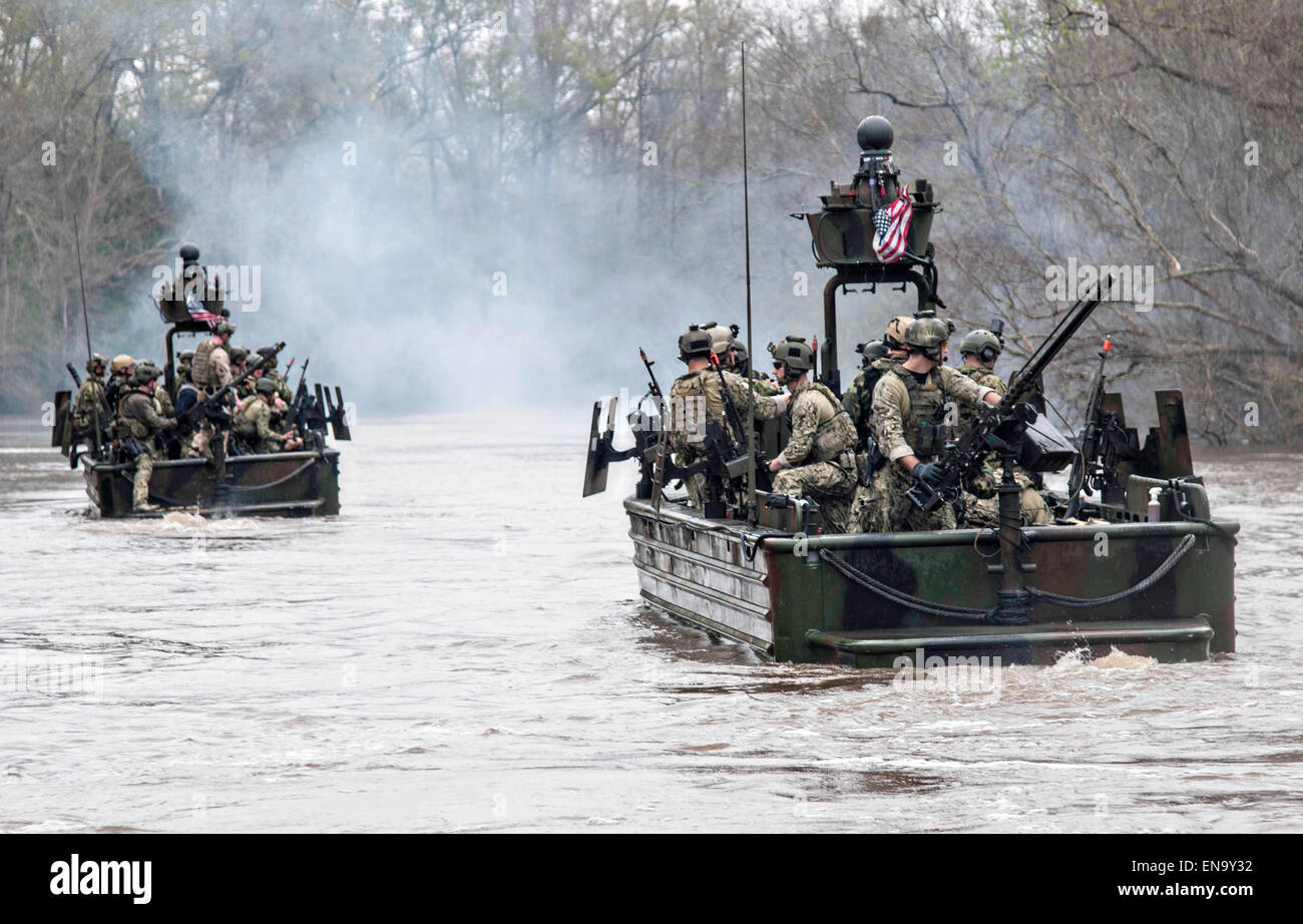 US Navy SEAL Special Boat Team 22 commandos during a Special Operations Craft Riverine demonstration at the Rivervine Training School along the Pearl River March 12, 2015 at the John C. Stennis Space Center, Mississippi. Stock Photo