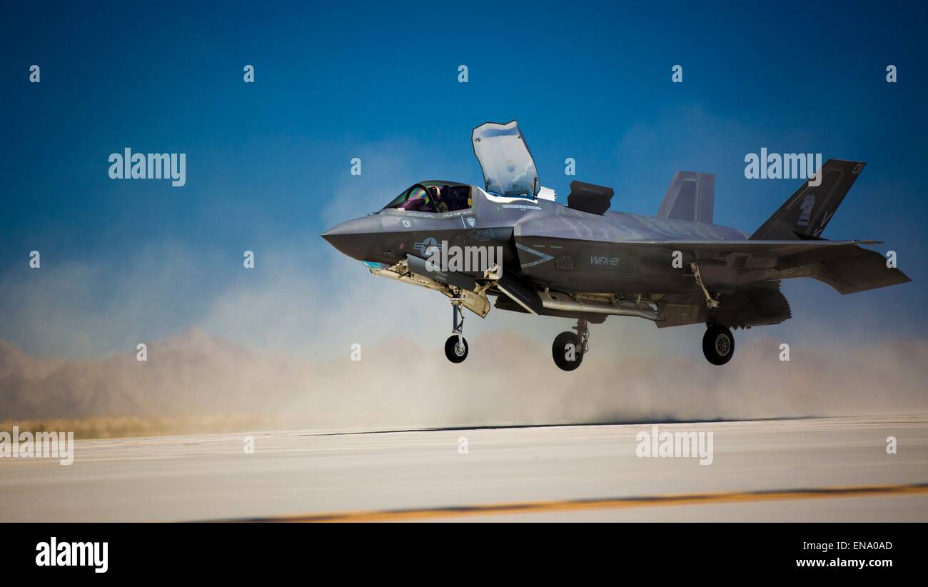 A US Marine Corps F-35B Lightning II fighter aircraft performs a vertical landing simulates the flight deck of an aircraft carrier to prepare pilots for landing and taking off at sea April 27, 2015 in Yuma, Arizona. Stock Photo