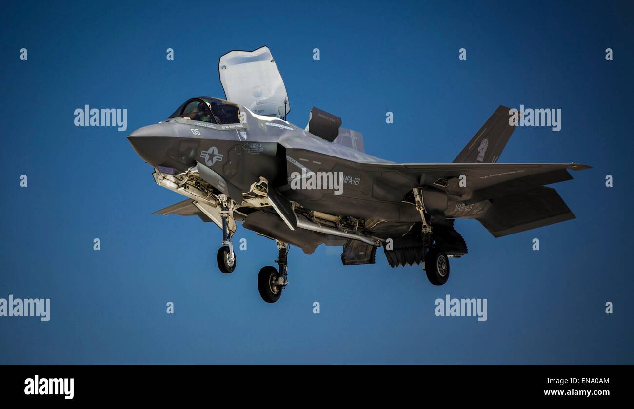 A US Marine Corps F-35B Lightning II fighter aircraft performs a vertical landing simulates the flight deck of an aircraft carrier to prepare pilots for landing and taking off at sea April 27, 2015 in Yuma, Arizona. Stock Photo